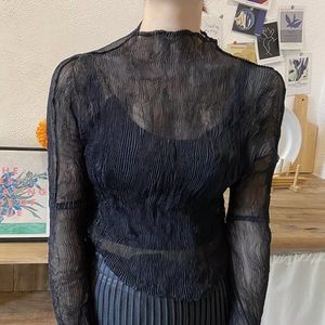 Black pleated sheer turtleneck